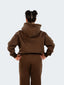 Model wearing oversized CAZBERA baggy hoodie and joggers in brown