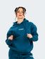 Model wearing oversized CAZBERA baggy hoodie and joggers in ocean blue.