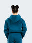 Model wearing oversized CAZBERA baggy hoodie and joggers in ocean blue.