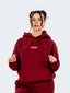 Model wearing oversized CAZBERA baggy hoodie and joggers in red