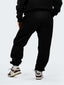 Model in black CAZBERA baggy joggers and hoodie